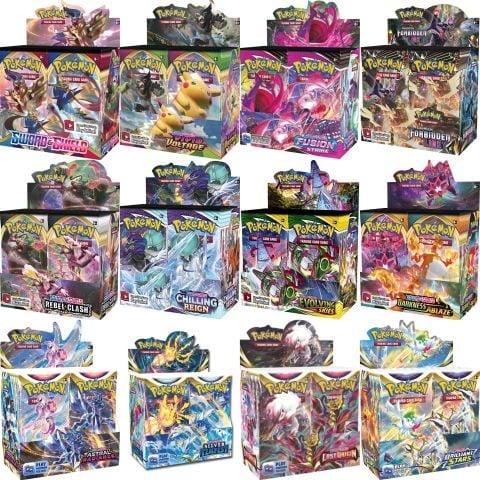 Collection of twelve Pokemon Trading Card Game booster boxes arranged in rows, displaying various set expansions with colorful artwork and Pokemon illustrations