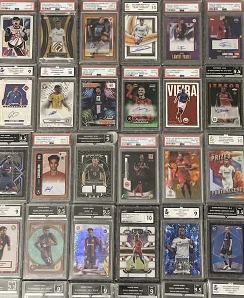 A collection of graded basketball trading cards displayed in a grid layout, showing various players and card designs from different eras